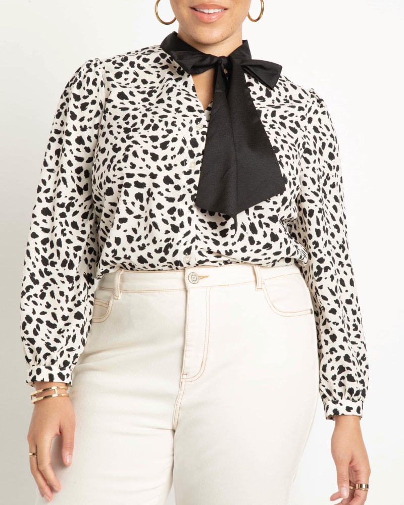 Front of a model wearing a size 14 Reina Tie Neck Blouse in In The Wild by ELOQUII. | dia_product_style_image_id:206778